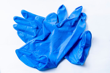 Two blue surgical gloves isolated on white background. Top view