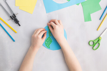 earth cut from paper around trees earth day concept kid's paper craft