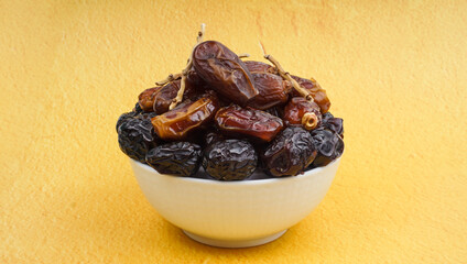 Dates or dattes palm fruit in wooden bowl is snack healthy, Set of various dates in bowl,