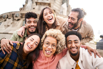 International students with beaming smiles are posing for selfie shot outdoors in university campus. Cheerful, smart and successful youth. High quality photo