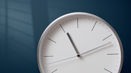 Nice metal hands of white clock go forward. wall clock shows time. Indistinguishable time, light...