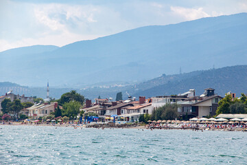 View from the Aegean sea to the shore of Turkey. Houses on the coast of the Aegean Sea