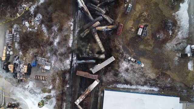 2023 - Excellent bird's eye view moving along the smoke rising from a derailed train in East Palestine, Ohio.