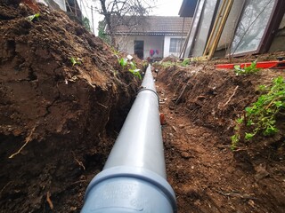 Plastic sawage pipes in the ground for rainwater drainage