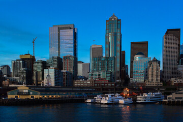 Fototapeta na wymiar Seattle waterfront skyline Puget Sound downtown Pier 56 blue hour