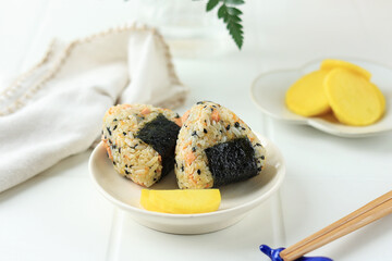 Triangle Japanese Onigiri with Sesame Seed, Sausage, Nori, and Ham.