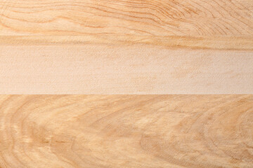 Wooden cutting board as background, closeup