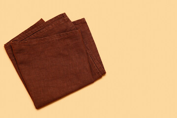 Folded clean napkin on color background