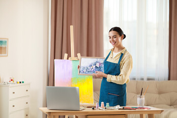 Teacher conducting online painting lesson at home. Time for hobby