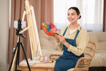 Teacher conducting online painting lesson at home. Time for hobby