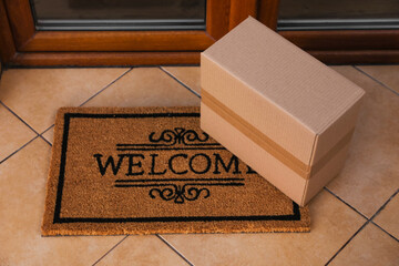Parcel delivered on mat near front door
