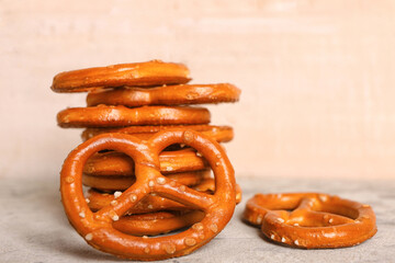 Tasty pretzels on light background, closeup