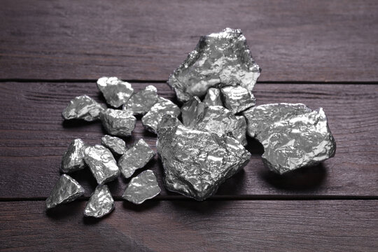 Pile of silver nuggets on wooden table