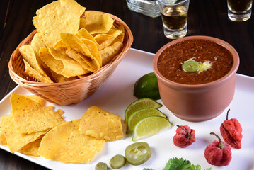 Mexican food tacos, fried chicken, greens, mango, avocado, pepper, red cabbage in tex-mex mix tortillas
