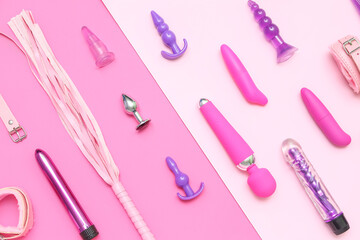 Different sex toys on pink background