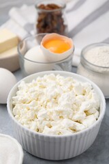 Different ingredients on light grey table. Cooking cottage cheese pancakes