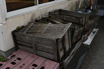 The abandoned old wooden boxes between buildings in Sapporo Japan