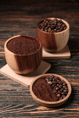 Bowls of coffee powder and beans on dark wooden background