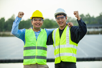 Two Engineer worker working together at Solar panel.