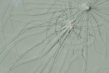 Cracks on the glass. Broken window.