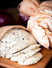 Fresh homemade spread cream cheese with herbs, garlic, chives and spices close up