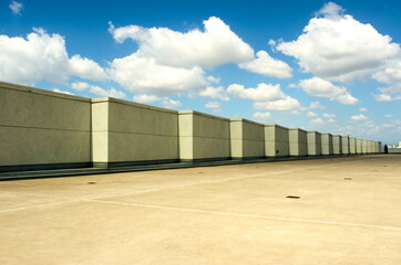 A Stepped Wall on Smooth Concrete under a Cloud Filled Sky