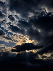 Fototapeta premium dark clouds at sunset before thunder storm with Ray of light