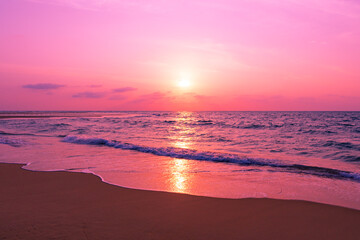Obraz premium Sunset or sunrise sky clouds over sea sunlight in Phuket Thailand, Amazing waves crashing on sandy shore, Beautiful nature landscape seascape Colorful sky background