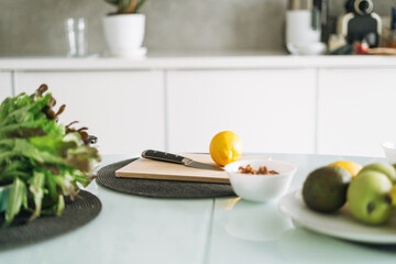 Fresh green healthy fruits and vegetables on table while cooking in kitchen at home