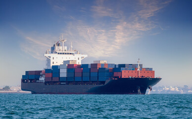 Cargo ship Transportation export import logistic business in ocean with sunset sky background	