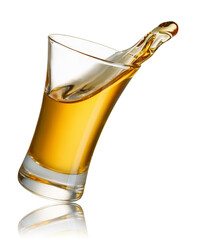 gold tequila shot with splash isolated on white