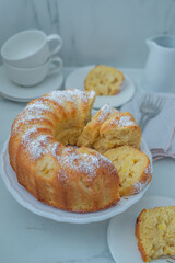 Lemon bundt cake drizzled with powdered sugar glaze