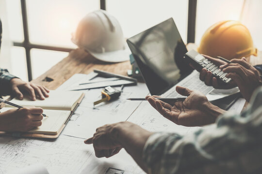 Architectural engineer team meeting Drawing and calculations for architectural structures and engineering tools in the workplace. Structural and technical construction concepts.