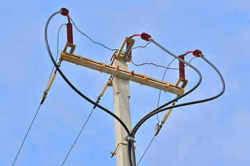 Connecting a cable to an overhead power line on a spring day