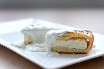 Slice Of Classical New York Cheesecake On A Blue Plate, Closeup View, Selective Focus. High quality photo