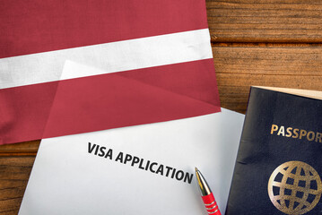 Fototapeta na wymiar Visa application form, passport and flag of Latvia 