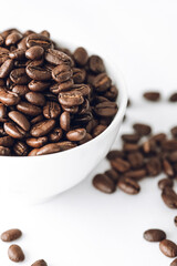 coffee beans in a cup with white background