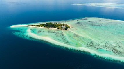 Top view of island Sibuan with sandy beach and coral reef. Tun Sakaran Marine Park. Borneo, Sabah, Malaysia.