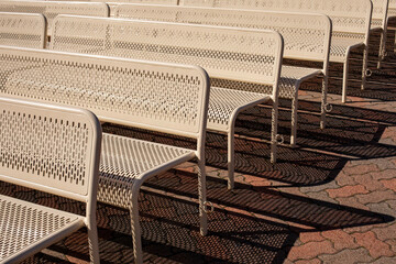 Metal benches and their shadows