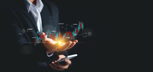 Businessman trader or stock market investor showing business growth chart Investing in online finance on virtual hologram,Plan analyzing goal,Strategy for investment, learning technology,Updated news.