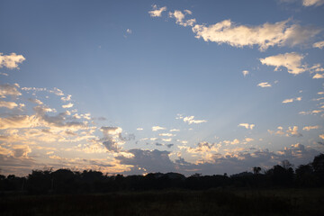Beautiful sky and cloud at high. Landscape include space, light of nature, sunset, sunrise, horizon or skyline. Colorful with yellow, orange and blue at evening in autumn for background and wallpaper.