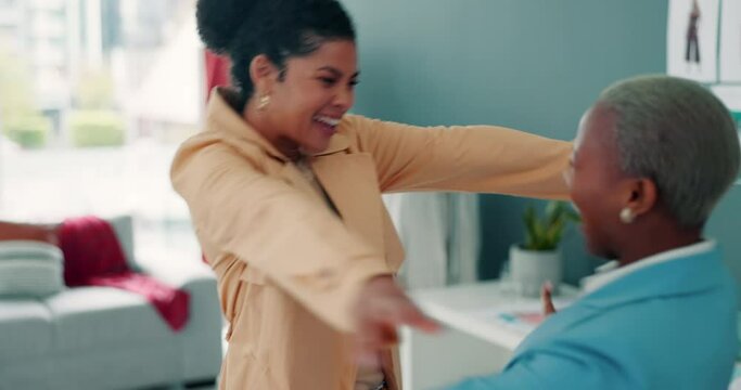 High five, small business and excited women in celebration in retail fashion store for a successful business deal for their startup. Happy, wow and female shop manager hugging a black woman at work