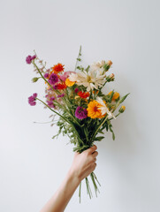 Girls hands holding beautiful bouquet flowers over white background, front view, women's day, valentines day, mothers day. Generative AI