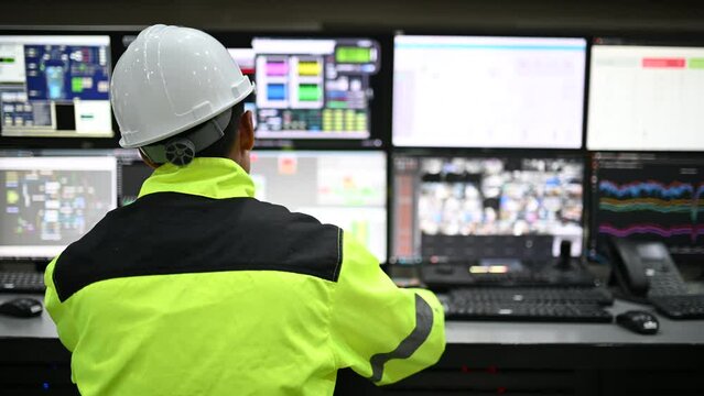 Engineer working at control room,Manager control system,Technician man monitoring program from a lot of monitor