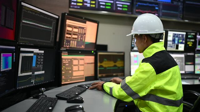 Engineer working at control room,Manager control system,Technician man monitoring program from a lot of monitor