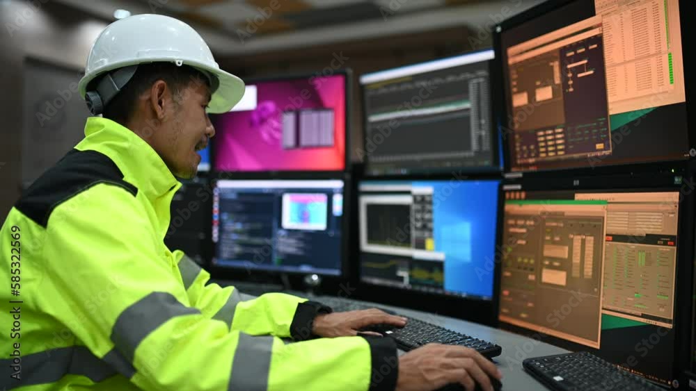 Wall mural engineer working at control room,manager control system,technician man monitoring program from a lot