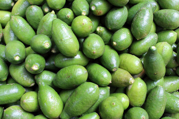 Green Color Lemon fruit background. Green Lemon fruits for sale. Green lemon background.