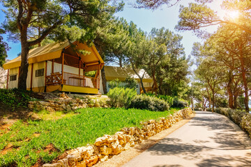 Stunning glamping with teepee camping tents in a wooded area. Croatia, Europe.