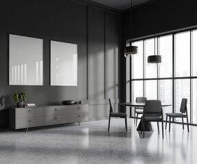 Gray dining room with dresser and posters