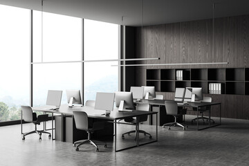 Grey office interior with pc computer and shelf near panoramic window